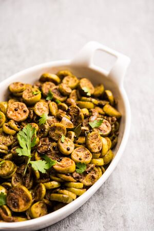 Tendli / Kundroo sabzi or Kovakkai Poriyal also known as ivy gourd, served in a ceramic bowl.の写真素材