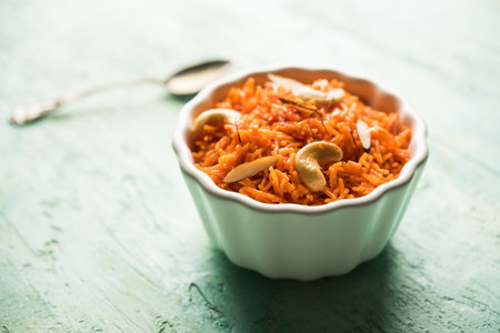 Vermicelli  / Semiya Kesari is a popular indian sweet served in a bowl, garnished with dry fruits like cashew and almond, made in pure gheeの写真素材