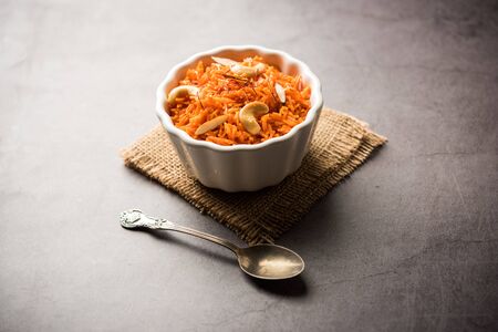 Vermicelli  / Semiya Kesari is a popular indian sweet served in a bowl, garnished with dry fruits like cashew and almond, made in pure gheeの写真素材