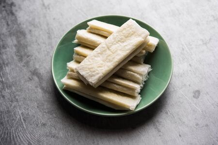 Pootharekulu is a popular recipe originated from Andhra Pradesh, India. It is a paper-thin sweet or dessert made from rice start/gram flour, jaggery/sugar and clarified butter.の写真素材