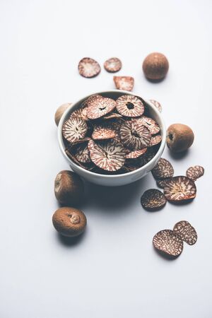 Betel nut chips in a bowl also known as slices of supari in india, used in Paan masalaの写真素材