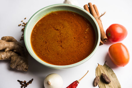 North Indian basic spicy Curry or masala for vegetables or chicken or mutton recipe shown with...