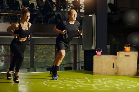 Couple at the gym exercisingの写真素材