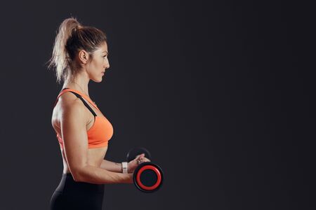 Woman at the gym exercisingの写真素材