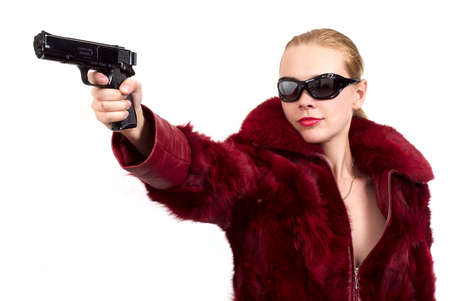 The blonde with a pistol in a handの写真素材