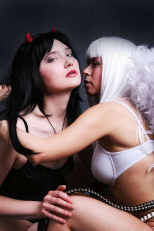 angel and devil girls, blond and brunetteの写真素材