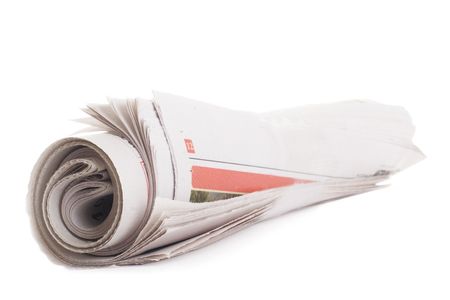 Rolled newspaper. Isolated on a white backgroundの写真素材