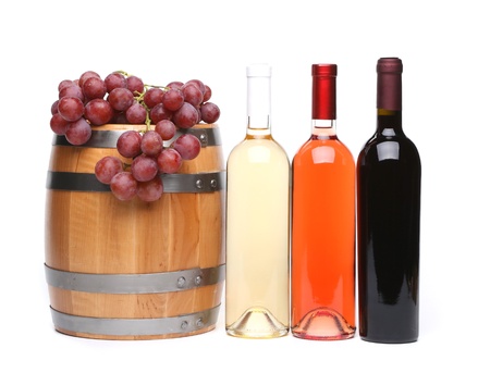barrel and bottles of wine and ripe grapes on woodenの写真素材