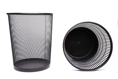 A metal trash can and a top plastic trash can lying on its siderash can lying on its sideの写真素材