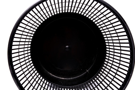 A top plastic trash can lying on its side close-upの写真素材