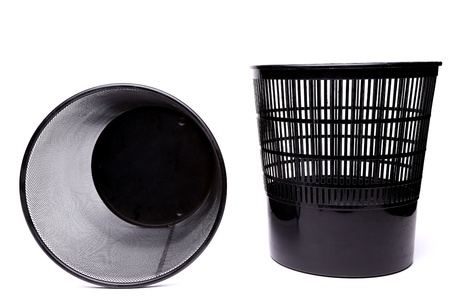 A plastic trash can and a top metal trash can lying on its siderash can lying on its sideの写真素材