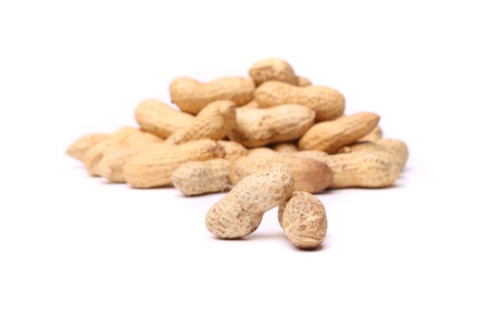 Two peanuts in closeup on the peanut backgroundの写真素材