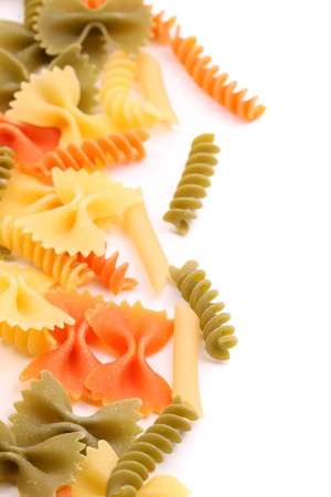 A different pasta in three colors close-up are located right on the white background.の写真素材