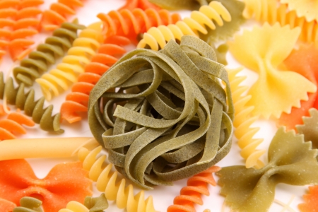 Green tagliatelle paglia e fieno on the backgroun of different pastas.の写真素材