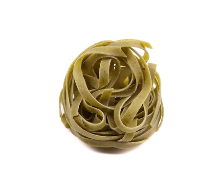Tagliatelle paglia e fieno homemade tipycal italian pasta close-up on the white backgroundの写真素材