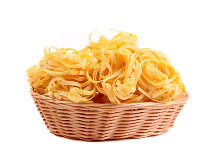 Tagliatelle paglia e fieno at round woven straw basketの写真素材