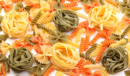 A different pasta in three colors on the white background.の写真素材