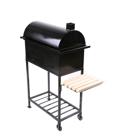 A picture of a new black barbecue with a cover close white backgroundの写真素材