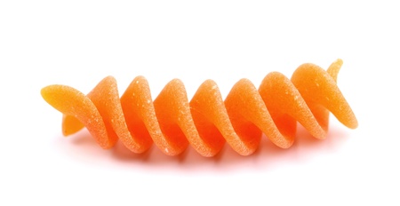 One piece of Italian red rotini pasta isolatedの写真素材