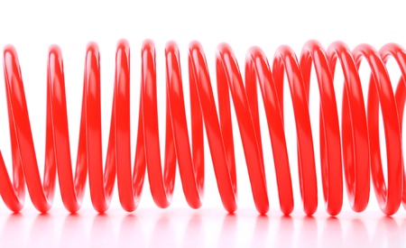 Plastic spring isolated on a white backgroundの写真素材