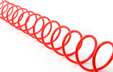 Plastic spring isolated on a white backgroundの写真素材