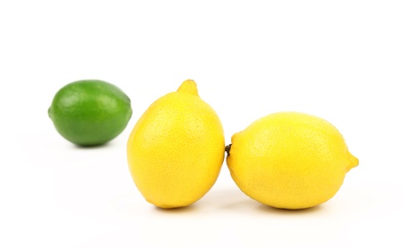 Fresh lime, two lemons isolated on whiteの写真素材