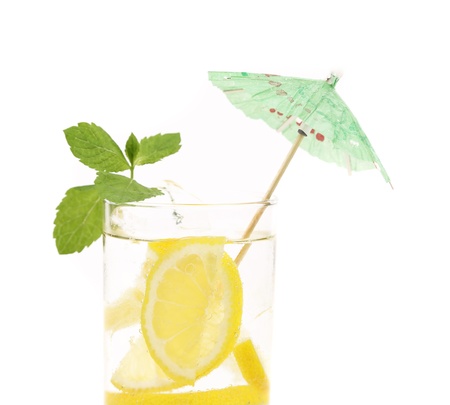 Full glass of water with lemon and mint isolated on white backgroundの写真素材