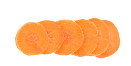 Raw carrot slices on a white backgroundの写真素材