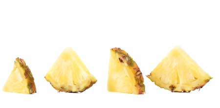 Quarters of slices pineapple on a white background.の写真素材