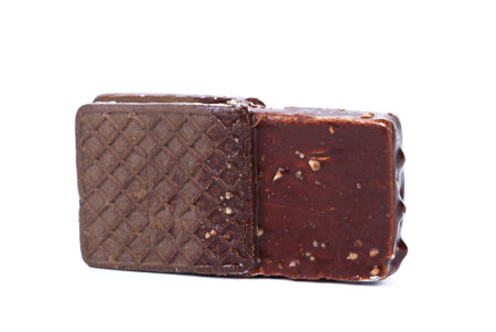 Chocolate-coated ice cream sandwich on a white background