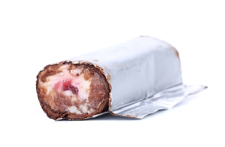 Roll of chocolate ice cream in foil  White background の写真素材