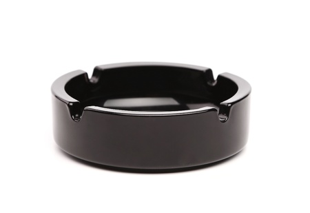 Empty black ceramic ashtray isolated on whiteの写真素材