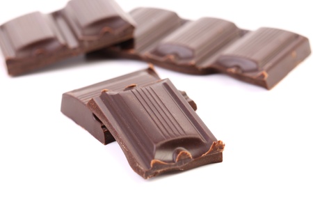 Tasty morsel of dark chocolate. White background.の写真素材