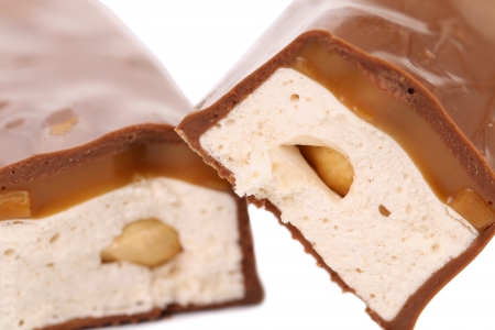 Slices bar of chocolate. Close up. White background.の写真素材