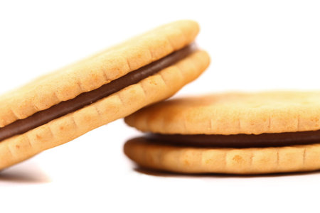 Closeup cookie biscuits with filling on white background