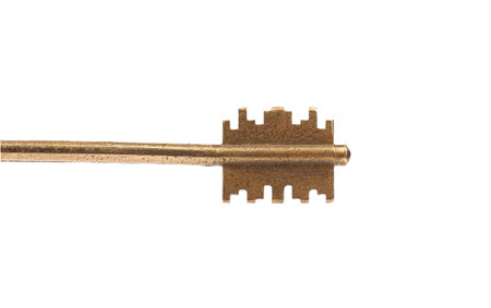  Head of bronze steel key. White background.