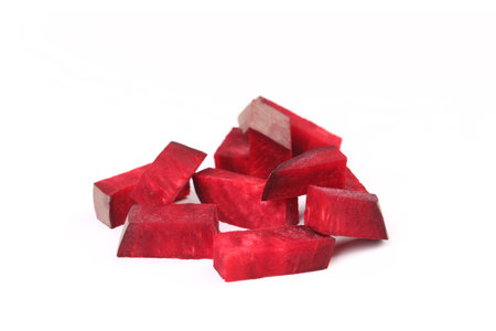 Fresh segments of a beet on a white backgroundの写真素材