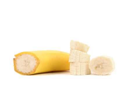 Cuted ripe bananas and slices isolated on a white background.の写真素材