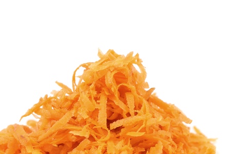 Heap of grated carrots isolated on a white backgroundの写真素材