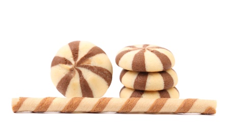 Striped chocolate wafer rolls and stake biscuits. White background.の写真素材
