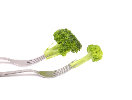 Different broccolies on two forks. White background.の写真素材