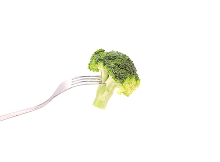 Fresh broccoli on a fork. White background.の写真素材