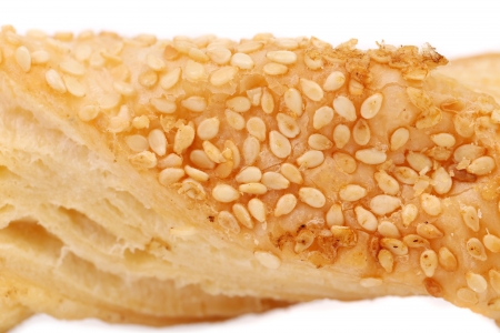 Cheese stick cracker with sesame seeds. Close up. White background.の写真素材