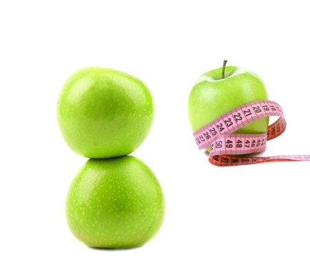 Green apples with tape measure の写真素材