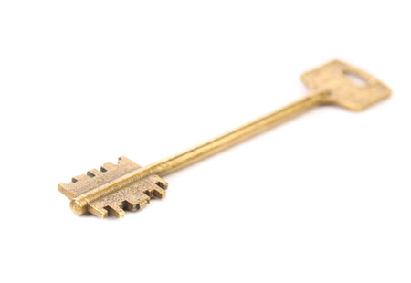 Bronze key. Isolated on a white background.の写真素材