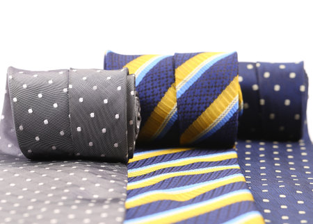 Three rolled up necktie isolated on white background.の写真素材