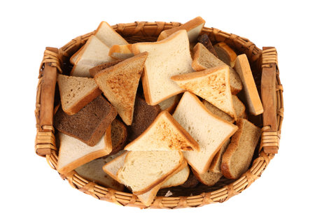 Full basket of different sliced ??bread. White background.