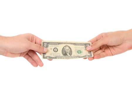 Hand holds american Dollar-bills. Isolated on a white background.の写真素材