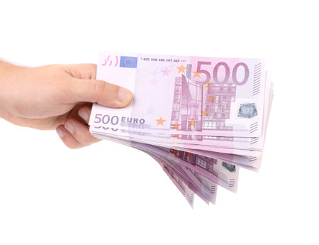 Hand holds five hundreds euros banknotes. Isolated on a white background.