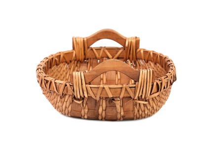 Empty wicker basket.Isolated on a white backgroundの写真素材